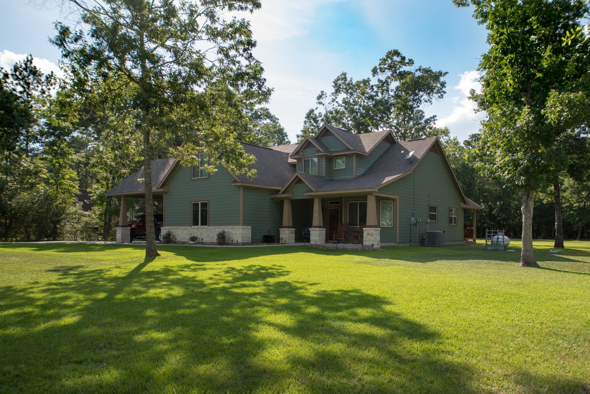 Custom home on a wooded acreage homesite at White Oak Trails